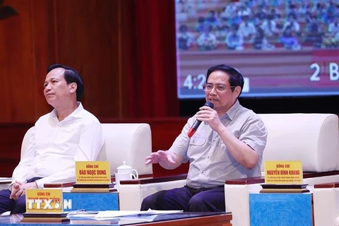 Thủ tướng Phạm Minh Chính đối thoại với công nhân lao động năm 2022. (Ảnh: Dương Giang/TTXVN)