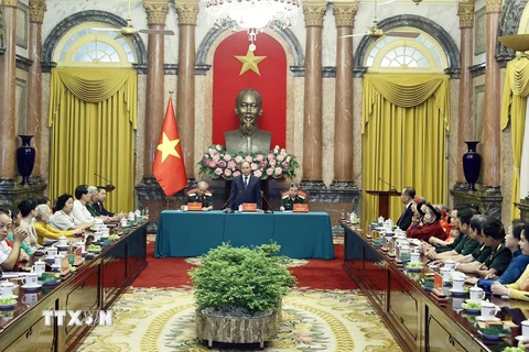 Chủ tịch nước Nguyễn Xuân Phúc phát biểu tại buổi gặp. (Ảnh: Thống Nhất/TTXVN)