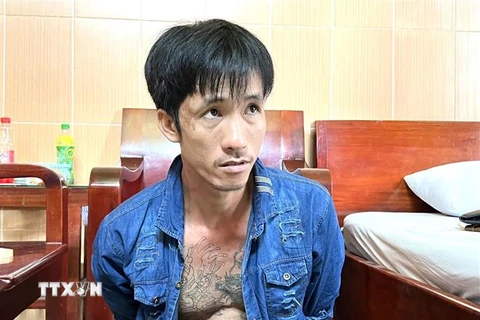 Đối tượng Nguyễn Minh Tâm bị công an bắt giữ. (Ảnh : TTXVN phát)