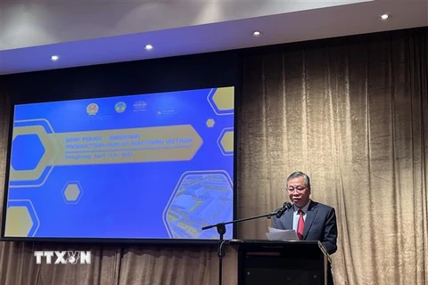 Ông Huỳnh Anh Minh, Phó Chủ tịch UBND tỉnh Bình Phước phát biểu tại Hội nghị xúc tiến đầu tư tỉnh Bình Phước-Hong Kong, Trung Quốc. (Ảnh: Mạc Luyện/TTXVN)