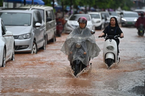 Cảnh ngập lụt sau những trận mưa lớn tại Khu tự trị dân tộc Choang Quảng Tây, Trung Quốc. (Ảnh: THX/TTXVN)