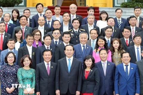 Chủ tịch nước Trần Đại Quang với các đại biểu tại buổi tiếp. (Ảnh: Nhan Sáng/TTXVN) 