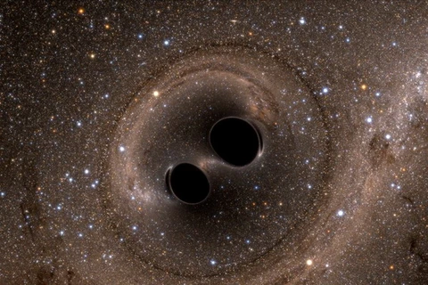 Một mô phỏng cho thấy hai lỗ đen sáp nhập, quá trình tạo ra các sóng hấp dẫn. (Nguồn: Nat Geo)