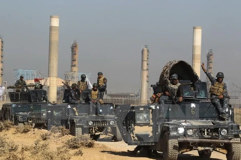 Các lực lượng Chính phủ Iraq tiến vào thành phố Kirkuk sau khi giành lại quyền kiểm soát thành phố này từ lực lượng người Kurd ngày 16/10. (Nguồn: AFP/TTXVN)