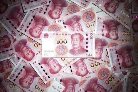 Đồng tiền mệnh giá 100 nhân dân tệ của Trung Quốc. (Ảnh: Kyodo/TTXVN)