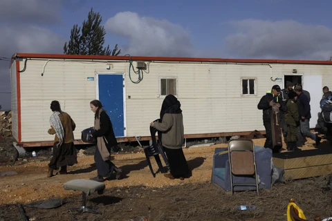 Người định cư Do Thái bị buộc di dời khỏi khu định cư Amona ngày 3/1/2019. (Ảnh: AFP/TTXVN)