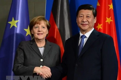 Chủ tịch Trung Quốc Tập Cận Bình và Thủ tướng Đức Angela Merkel (trái). (Nguồn: AFP/TTXVN)