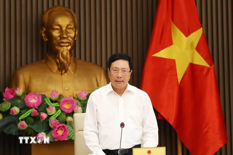 Phó Thủ tướng, Bộ trưởng Bộ Ngoại giao Phạm Bình Minh chủ trì họp Tổ công tác thúc đẩy hợp tác đầu tư nước ngoài. (Ảnh: Lâm Khánh/TTXVN)