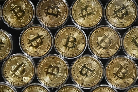 Đồng tiền kỹ thuật số bitcoin. (Ảnh: AFP/TTXVN) 