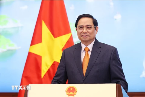 Thủ tướng Chính phủ Phạm Minh Chính phát biểu tại Hội nghị thượng đỉnh thương mại dịch vụ toàn cầu năm 2021 theo hình thức ghi hình. (Ảnh: Dương Giang/TTXVN)