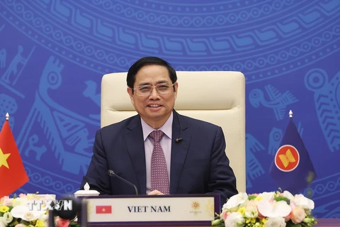 Thủ tướng Phạm Minh Chính dự Hội nghị cấp cao ASEAN-Ấn Độ lần thứ 18 theo hình thức trực tuyến tại điểm cầu Hà Nội. (Ảnh: Dương Giang/TTXVN) . 