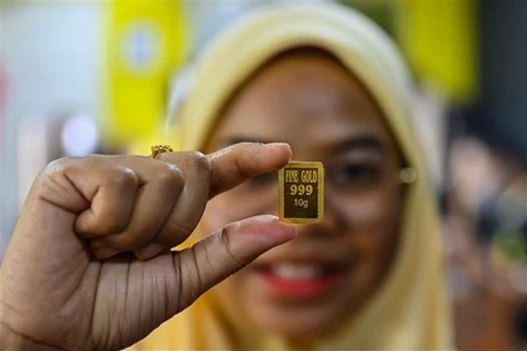 Vàng miếng được trưng bày tại Kota Bharu, bang Kelantan (Malaysia). (Ảnh: AFP/TTXVN) 