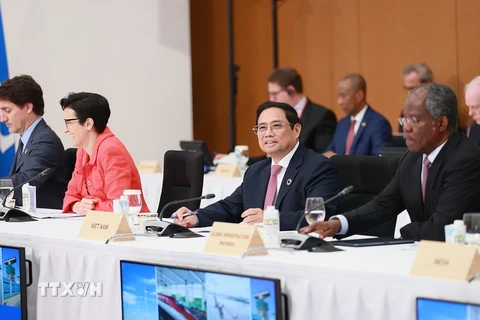 Hình ảnh Thủ tướng Phạm Minh Chính tham dự phiên thảo luận. (Ảnh: Dương Giang/TTXVN) 