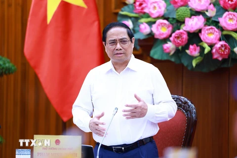 Thủ tướng Phạm Minh Chính kết luận buổi làm việc với các đơn vị để đẩy nhanh tiến độ hoàn thành Dự án đường dây 500kV mạch 3. (Ảnh: Dương Giang/TTXVN)