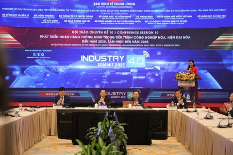 Hội thảo “Phát triển ngân hàng thông minh trong tiến trình công nghiệp hóa, hiện đại hóa đến năm 2030, tầm nhìn đến năm 2045,” ngày 18/11. (Ảnh: Vietnam+)