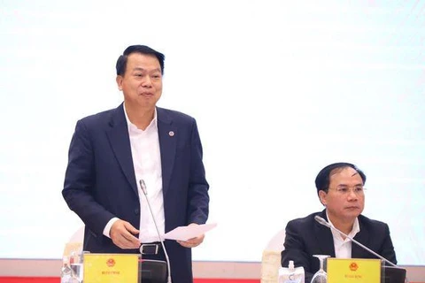 Thứ trưởng Bộ Tài chính Nguyễn Đức Chi trả lời báo chí tại buổi họp báo Chính phủ thường kỳ tháng 11/2022. (Ảnh: Vietnam+)