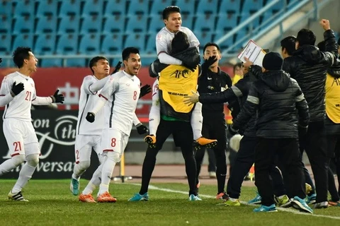 Niềm vui của các cầu thủ U23 Việt Nam và ban huấn luyện. (Nguồn: AFC) 