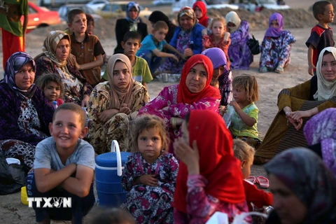 Các gia đình Iraq rời bỏ nhà cửa do bạo lực. (Nguồn: AFP/TTXVN)