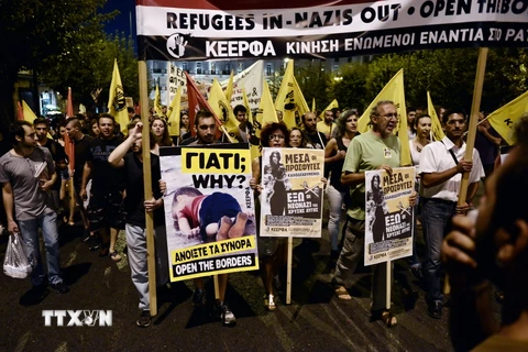 Tuần hành ủng hộ người di cư tại Athens, Hy Lạp ngày 12/9. (Nguồn: AFP/TTXVN)