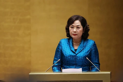 Thống đốc Ngân hàng Nhà nước Việt Nam Nguyễn Thị Hồng trình bày Báo cáo tổng kết. (Ảnh: Dương Giang/TTXVN)