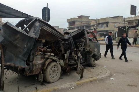 Hiện trường một vụ đánh bom xe tại Sadr City, phía Đông Bắc thủ đô Baghdad. (Nguồn: AFP/TTXVN)