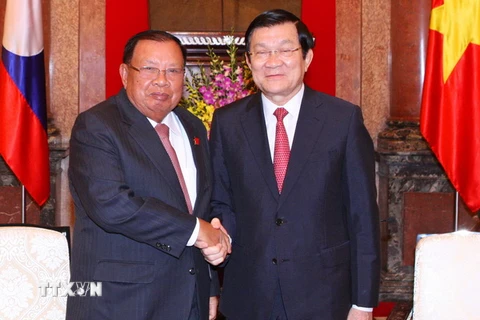 Chủ tịch nước Trương Tấn Sang tiếp Phó Chủ tịch nước Lào Bounnhang Vorachith. (Ảnh: Thống Nhất/TTXVN)