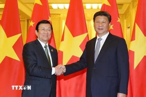 Chủ tịch nước Trung Quốc Tập Cận Bình đón Chủ tịch nước Trương Tấn Sang. (Ảnh: Nguyễn Khang/TTXVN)