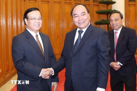 Phó Thủ tướng Nguyễn Xuân Phúc tiếp Bộ trưởng Bộ Kế hoạch và Đầu tư Lào Somdy Douangdy. (Ảnh: Phương Hoa/TTXVN)