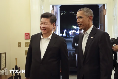 Tổng thống Mỹ Barack Obama (phải) và Chủ tịch Trung Quốc Tập Cận Bình. (Nguồn: THX/TTXVN)