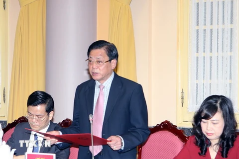 Phó Chủ nhiệm Văn phòng Chủ tịch nước Giang Sơn công bố Pháp lệnh của Chủ tịch nước. (Ảnh: Nguyễn Dân/TTXVN)