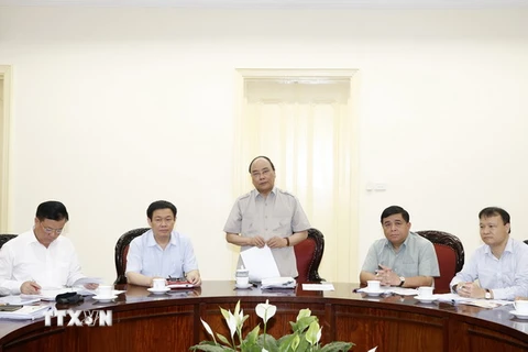 Thủ tướng Nguyễn Xuân Phúc chủ trì cuộc họp. )Ảnh: Thống Nhất/TTXVN)