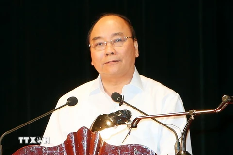 Thủ tướng Nguyễn Xuân Phúc dự và phát biểu tại Hội nghị tổng kết Dự án di dân, tái định cư Thủy điện Sơn La. (Ảnh: Thống Nhất/TTXVN)