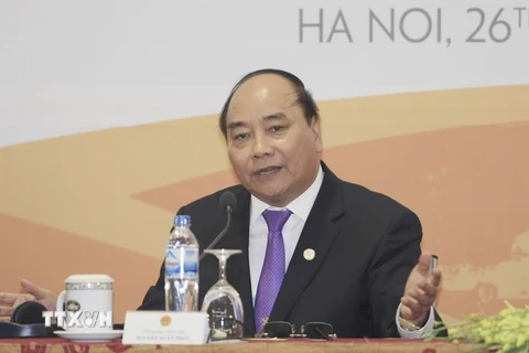 Thủ tướng Nguyễn Xuân Phúc chủ trì buổi họp báo quốc tế. (Nguồn: TTXVN) 