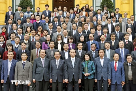 Chủ tịch nước Trần Đại Quang với các đại biểu tham dự buổi gặp mặt. (Ảnh: Nhan Sáng/TTXVN)