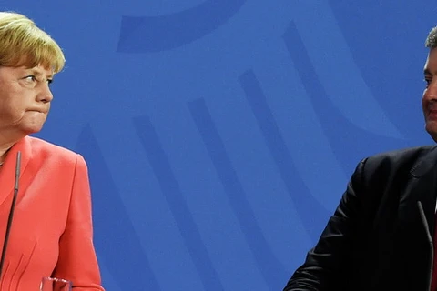 Thủ tướng Đức Angela Merkel và Tổng thống Ukraine Petro Poroshenko. (Nguồn: AFP)