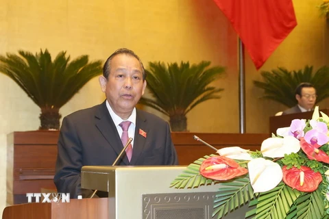 Phó Thủ tướng Thường trực Chính phủ Trương Hòa Bình trình bày Báo cáo. (Ảnh: Doãn Tấn/TTXVN)