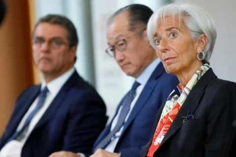 Tổng Giám đốc IMF Christine Lagarde, Chủ tịch Ngân hàng Thế giới Jim Yong Kim, và Tổng Giám đốc WTO Roberto Azevedo