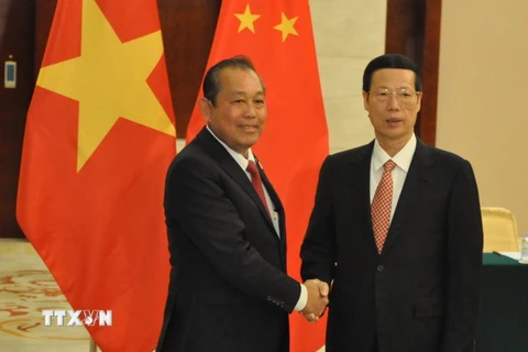 Phó Thủ tướng Trương Hòa Bình (trái) hội kiến Phó Thủ tướng Trung Quốc Trương Cao Lệ. (Ảnh: Lê Trung Kiên/TTXVN)
