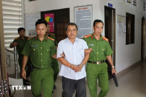 Ông Lê Văn Hồng Anh bị bắt tại nơi làm việc. (Ảnh: Thanh Hòa/TTXVN)