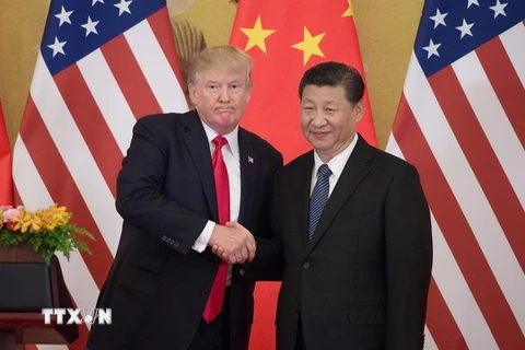 Tổng thống Mỹ Donald Trump (trái) và Chủ tịch Trung Quốc Tập Cận Bình tại Đại lễ đường Nhân dân ở Bắc Kinh. (Nguồn: AFP/TTXVN)