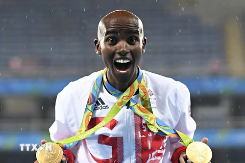Vận động viên Mo Farah sau khi nhận Huy chương Vàng cự li chạy 5.000m nam tại Olympic Rio de Janeiro 2016. (Nguồn: AFP/TTXVN)