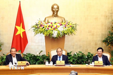 Thủ tướng Nguyễn Xuân Phúc tại cuộc họp về tình hình Tết Nguyên đán Mậu Tuất. (Ảnh: Thống Nhất/TTXVN)