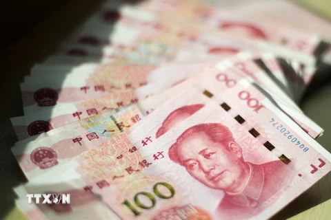 Đồng tiền mệnh giá 100 nhân dân tệ. (Nguồn: AFP/TTXVN)