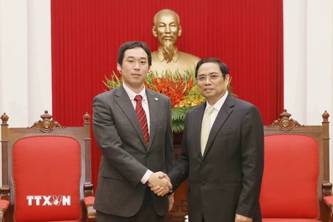 Trưởng Ban Tổ chức Trung ương Phạm Minh Chính tiếp ông Tana CaIu, Phó Trưởng Ban Bí thư Trung ương Đảng Cộng sản Nhật Bản. (Ảnh: Phương Hoa/TTXVN)