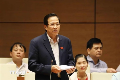 Bộ trưởng Bộ Lao động-Thương binh và Xã hội Đào Ngọc Dung trả lời chất vấn của đại biểu Quốc hội. (Ảnh: Phương Hoa/TTXVN)