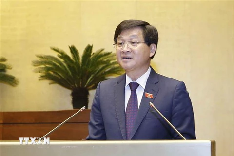 Tổng Thanh tra Chính phủ Lê Minh Khái, thừa ủy quyền của Thủ tướng Chính phủ, trình bày Báo cáo về công tác phòng, chống tham nhũng năm 2018. (Ảnh: Doãn Tấn/TTXVN)