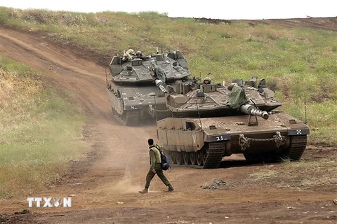 Binh sỹ Israel tham gia một cuộc tập trận tại khu vực cao nguyên Golan. (Nguồn: AFP/TTXVN)
