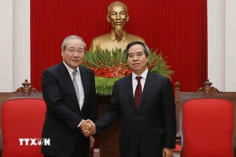 Trưởng Ban Kinh tế Trung ương Nguyễn Văn Bình tiếp ông Koichi Miyata. (Ảnh: Phương Hoa/TTXVN)