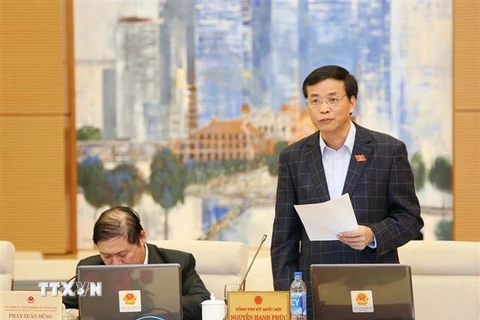 Tổng Thư ký Quốc hội Nguyễn Hạnh Phúc trình bày các báo cáo Tổng kết Kỳ họp thứ 6 và cho ý kiến bước đầu về việc chuẩn bị Kỳ họp thứ 7 của Quốc hội. (Ảnh: Dương Giang/TTXVN)