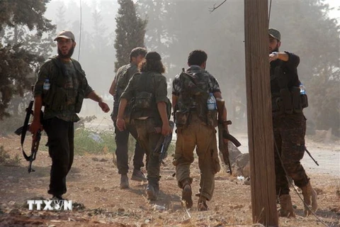 Các tay súng Fateh al-Sham tại khu vực Aleppo, Syria. (Nguồn: AFP/TTXVN)